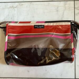 Kate Spade cosmetic bag in signature luggage stripe print.